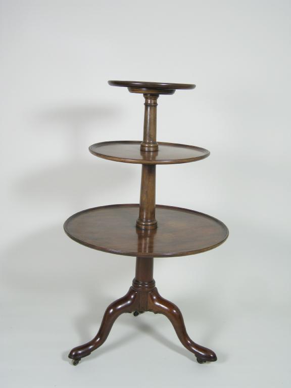 Appraisal: A George III mahogany three tier circular graduated Revolving Dumb