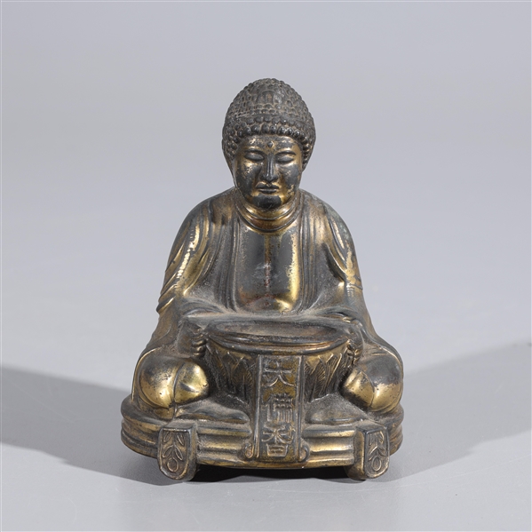 Appraisal: Bronze statue of Buddha seatched with bowl in flowing robes