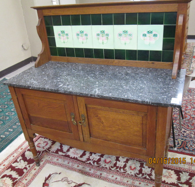 Appraisal: LATE VICTORIAN OAK WASHSTAND English c having a green ceramic