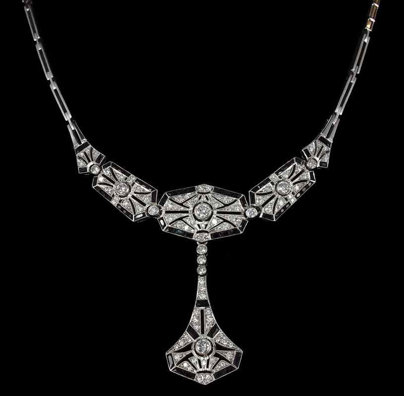 Appraisal: PLATINUM DIAMOND ONYX CONVERTIBLE NECKLACE TO BRACELET Two jewelry pieces