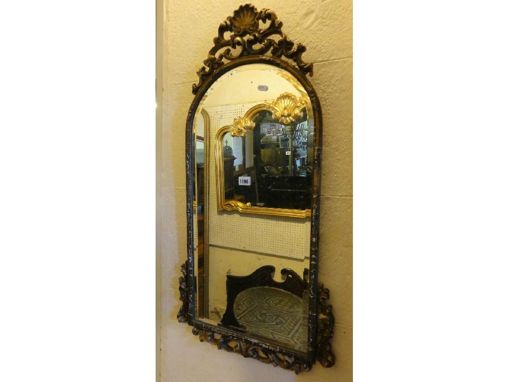 Appraisal: A wall mirror of arched form with scrolling acanthus and