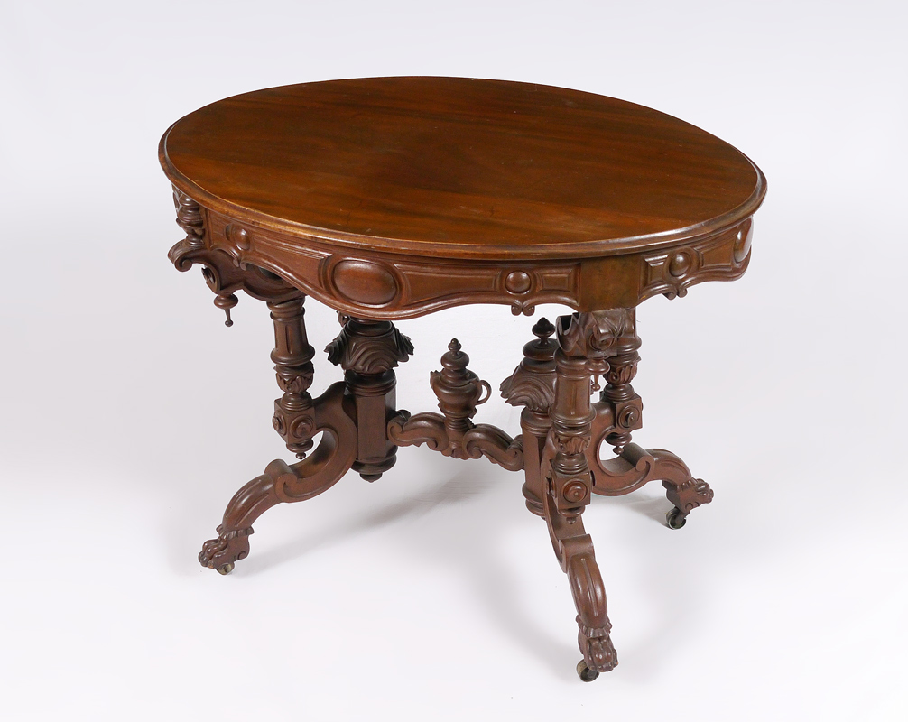 Appraisal: VICTORIAN MAHOGANY PARLOR TABLE Oval top carved and shaped skirt