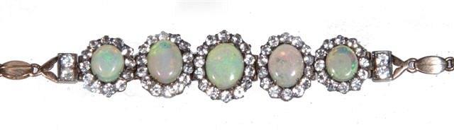 Appraisal: AN OPAL AND WHITE SAPPHIRE PANEL BRACELET five graduated claw