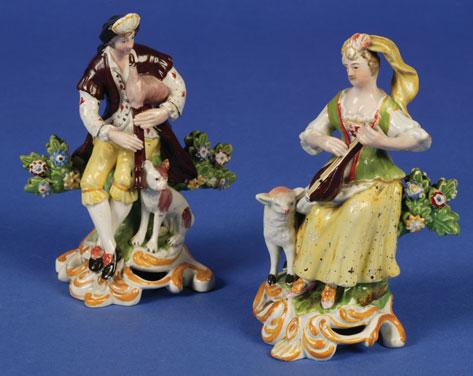 Appraisal: A PAIR OF STAFFORDSHIRE FIGURES of itinerant musicians the male