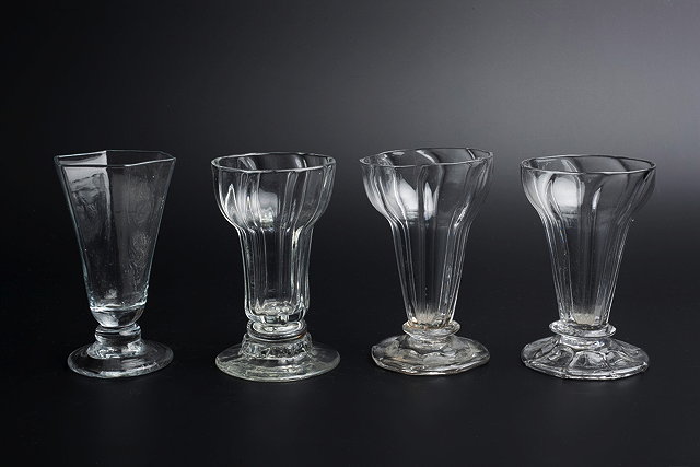 Appraisal: A GEORGE III SYLLABUB GLASS of panelled ogee form cm