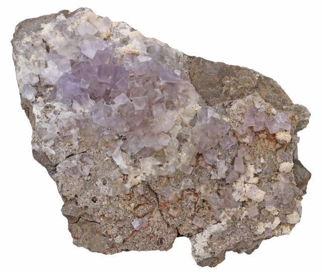 Appraisal: Large purple fluorite crystal quartz specimen in natural rock formation