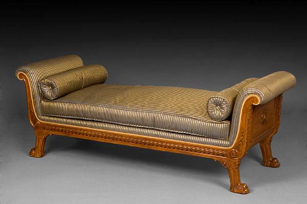 Appraisal: A Neoclassical style carved hardwood daybed fully upholstered with banquette