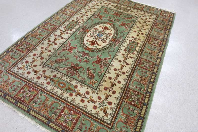 Appraisal: HAND KNOTTED ORIENTAL CARPET Indo-French floral and central floral medallion