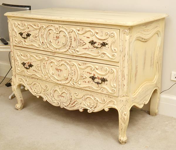 Appraisal: A PAINTED AND CARVED TWO DRAWER COMMODE WITH CABRIOLE LEGS