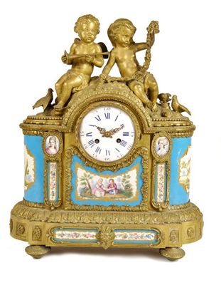 Appraisal: A th century French ormolu and porcelain mounted mantel clock