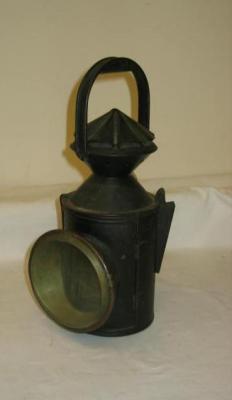 Appraisal: A tin plate railway lamp stamped NER with revolving top