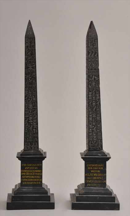 Appraisal: PAIR OF CARVED BLACK MARBLE GRAND TOUR OBELISKS Each shaft