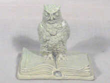 Appraisal: A model of an owl perched on an open book