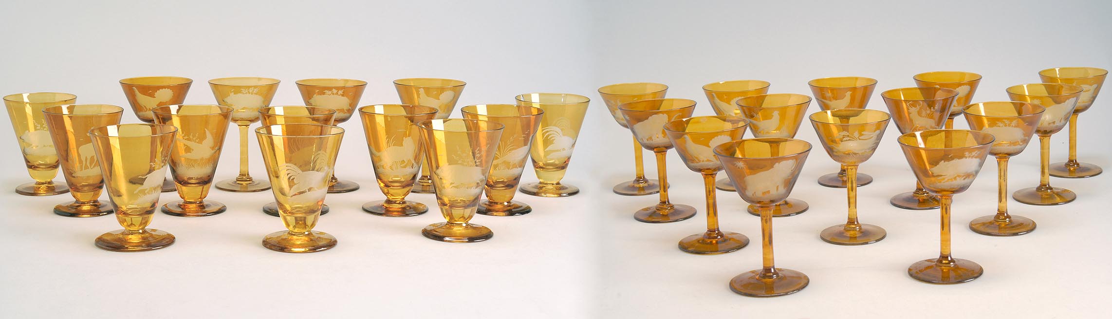 Appraisal: SET OF TWENTY-EIGHT BOHEMIAN ETCHED GLASS DRINKING GLASSES in amber