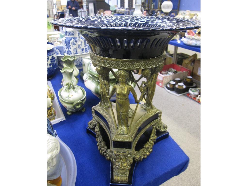 Appraisal: Large blue glazed pottery bowl upon a gilt metal figural