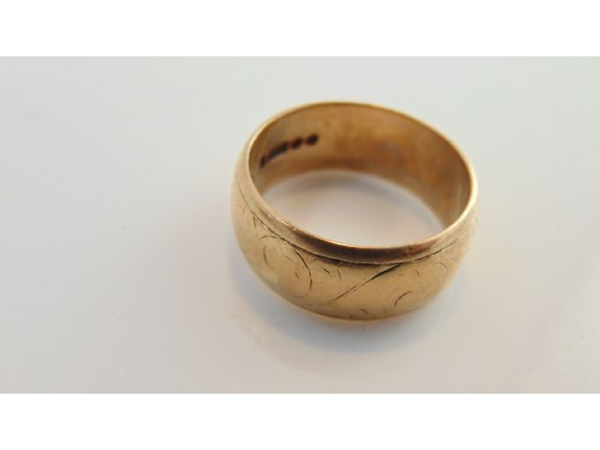 Appraisal: A ct gold wedding ring with worn scrolling details g