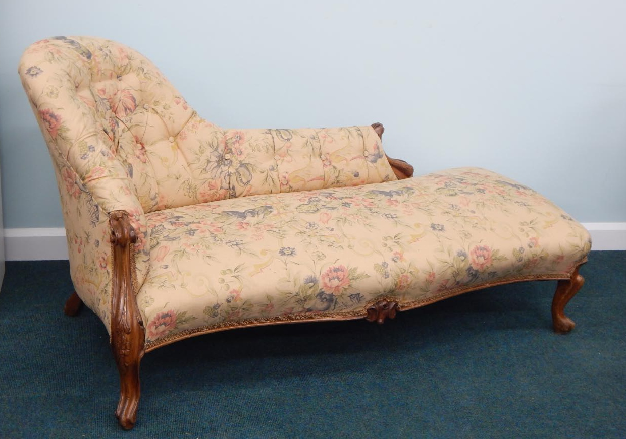 Appraisal: A Victorian walnut chaise lounge re upholstered in coloured floral