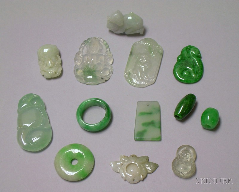 Appraisal: Green Jade Saddle Ring and Twelve Mostly Jade Pendants and