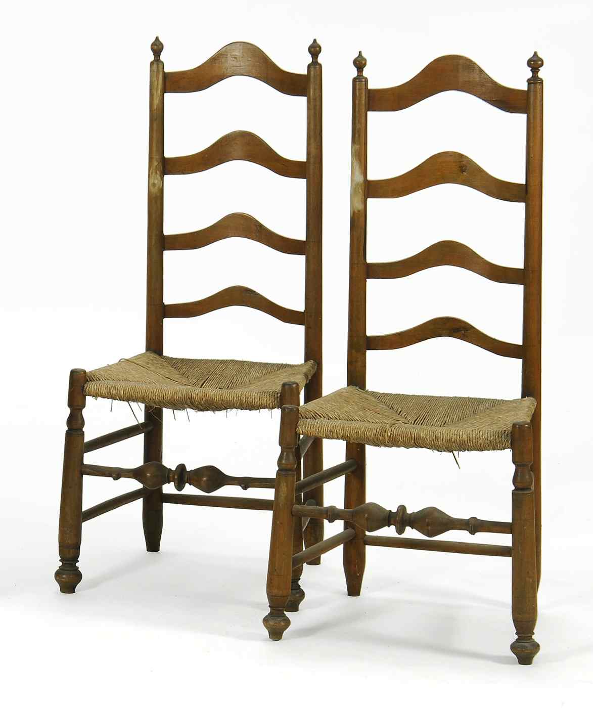 Appraisal: PAIR OF ANTIQUE AMERICAN LADDERBACK RUSH-SEAT SIDE CHAIRS th CenturyProbably