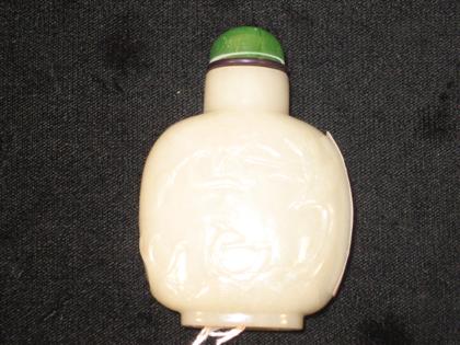 Appraisal: Chinese brown and white jade cameo carved snuff bottle th