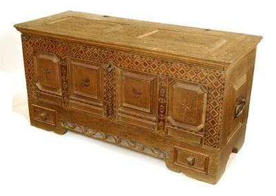 Appraisal: A continental oak and parquetry chest the hinged twin panel