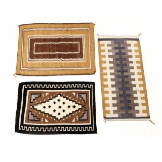 Appraisal: Three Navajo Area Rugs the first centered with an ivory