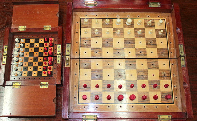 Appraisal: AN EARLY TH CENTURY MAHOGANY FOLDING TRAVEL CHESS SET with