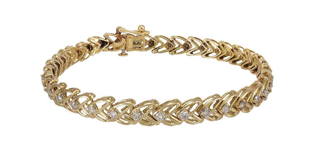 Appraisal: K DIAMOND LINE BRACELET K yellow gold bracelet contains round