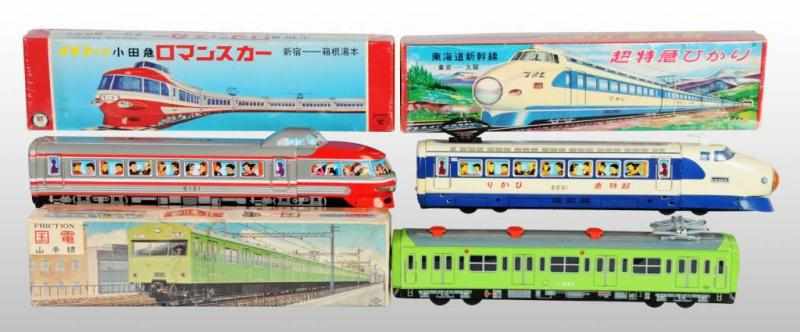 Appraisal: Lot of Tin Train Friction Toys Description Japanese Working Two