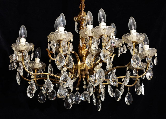 Appraisal: A GILT METAL AND GLASS TEN BRANCH CHANDELIER with lozenge