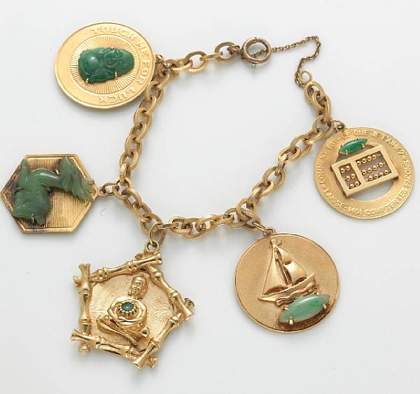 Appraisal: A k gold charm bracelet suspending five jade-set charms gross