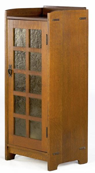 Appraisal: GUSTAV STICKLEY Music cabinet no with ten hammered amber glass