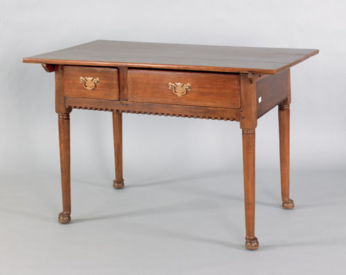 Appraisal: Pennsylvania walnut tavern table th c the removable top extending