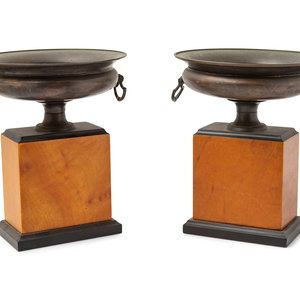 Appraisal: A Pair of Grand Tour Style Cast Metal Urns on