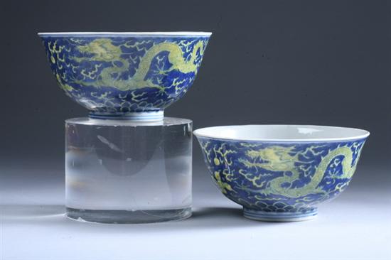 Appraisal: PAIR CHINESE BLUE AND YELLOW PORCELAIN DRAGON BOWLS Kangxi six-character