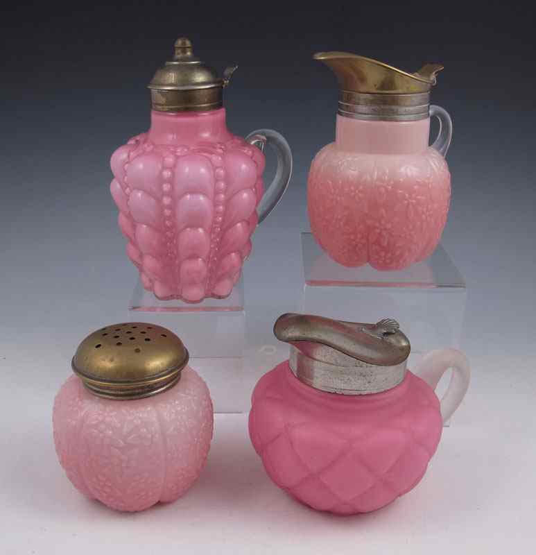 Appraisal: VICTORIAN ART GLASS SYRUP PITCHERS AND A SUGAR SHAKER Three