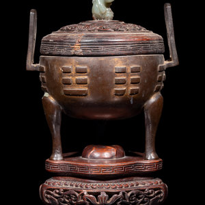 Appraisal: A Chinese Cast Bronze Tripod Incense Burner the compressed body