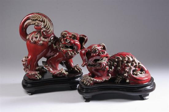 Appraisal: TWO COPPER RED PORCELAIN FIGURES OF DOGS - in long