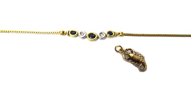 Appraisal: A gold sapphire and diamond set necklace the front mounted