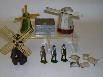 Appraisal: Twelve metal figures comprising three various Britains farm labourers an