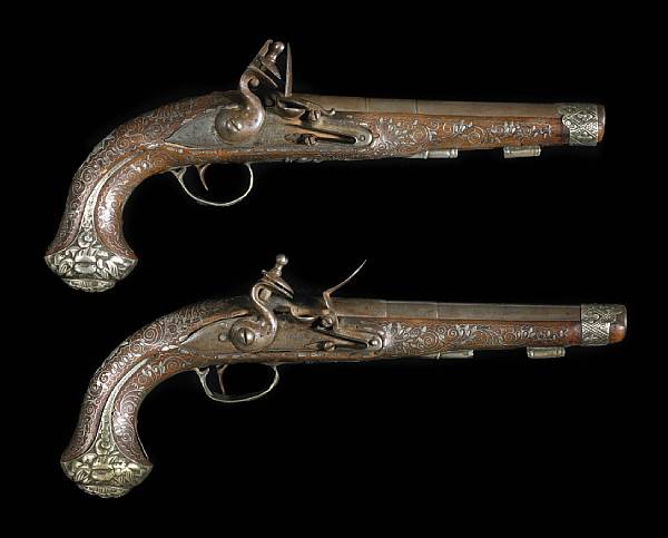 Appraisal: A pair of silver-mounted Ottoman flintlock pistols with English locks