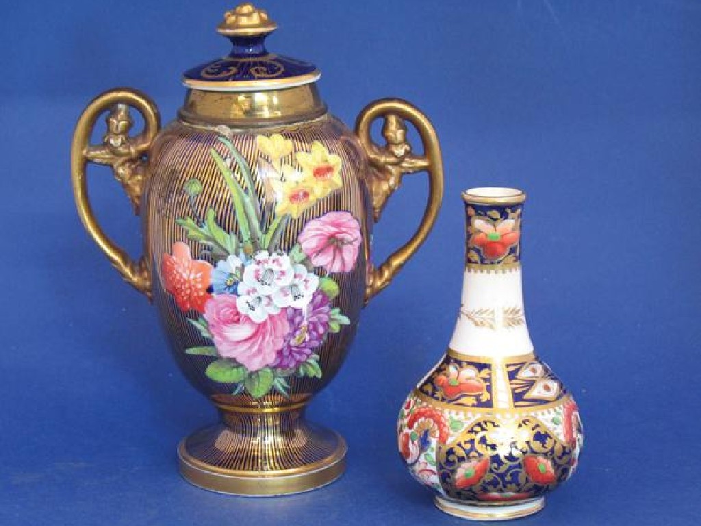 Appraisal: A COALPORT STYLE VASE AND COVER of baluster form painted