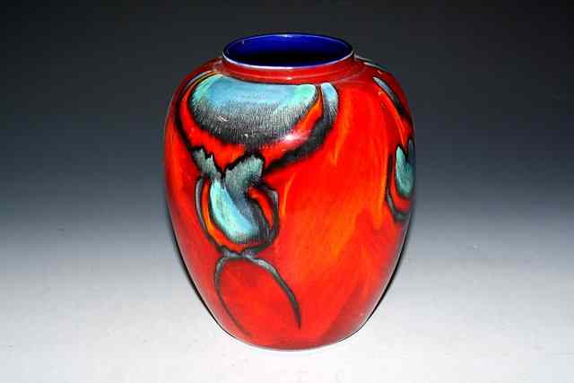 Appraisal: A POOLE POTTERY BALUSTER VASE decorated with abstract blue markings