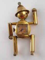 Appraisal: A gilt metal brooch watch designed as The Tinman with