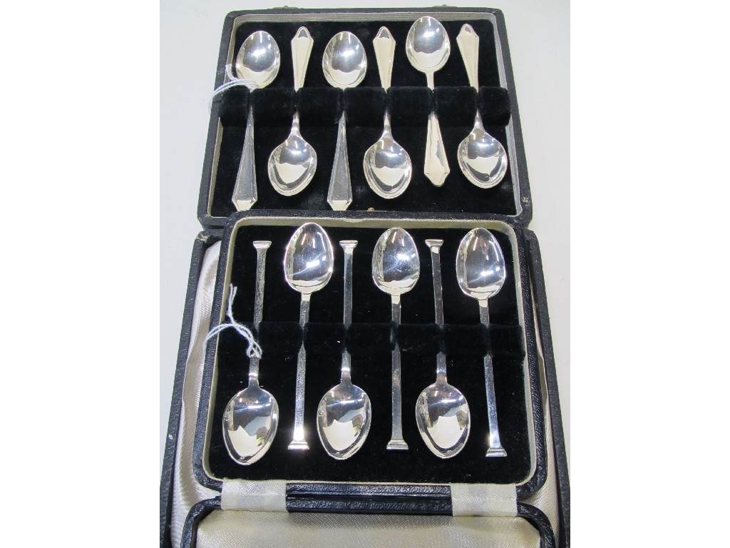 Appraisal: Lot comprising two cased sets of six silver spoons Birmingham