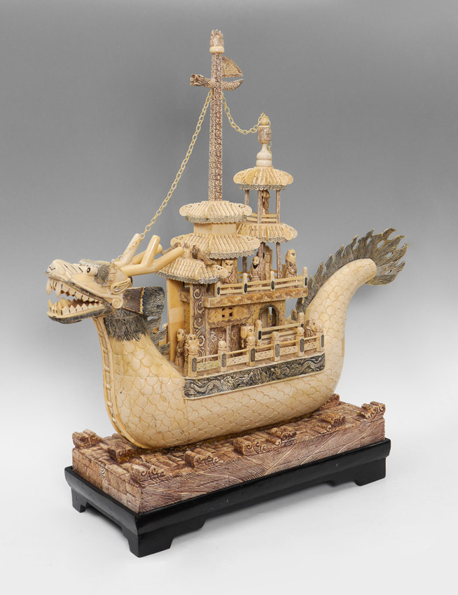 Appraisal: CHINESE BONE CLAD DRAGON BOAT Dragon form boat with applied