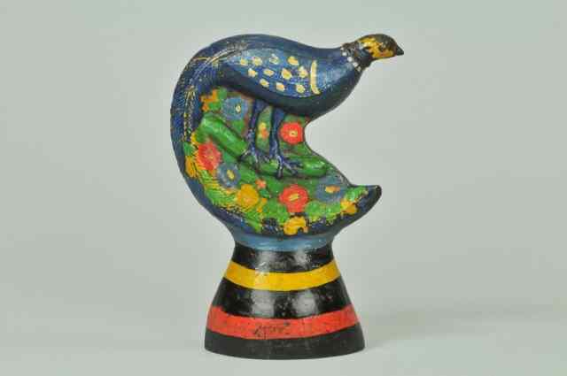 Appraisal: PEACOCK ON BARREL DOORSTOP BOOK EXAMPLE cast iron artistic rendering