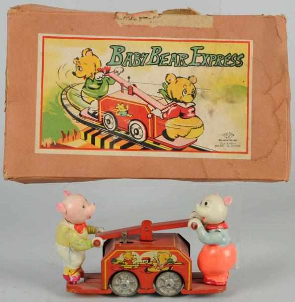 Appraisal: Celluloid Handcar Wind-Up Toy Japanese Pre-war Complete but heads are