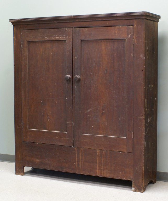 Appraisal: Walnut door linen press wall cupboard with a divided interior