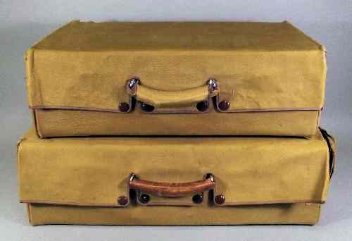 Appraisal: Two s brown leather hide suitcases with canvas covers ins